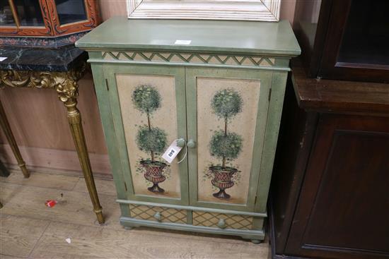 A small Regency style green and cream painted and decorated cupboard W.61cm